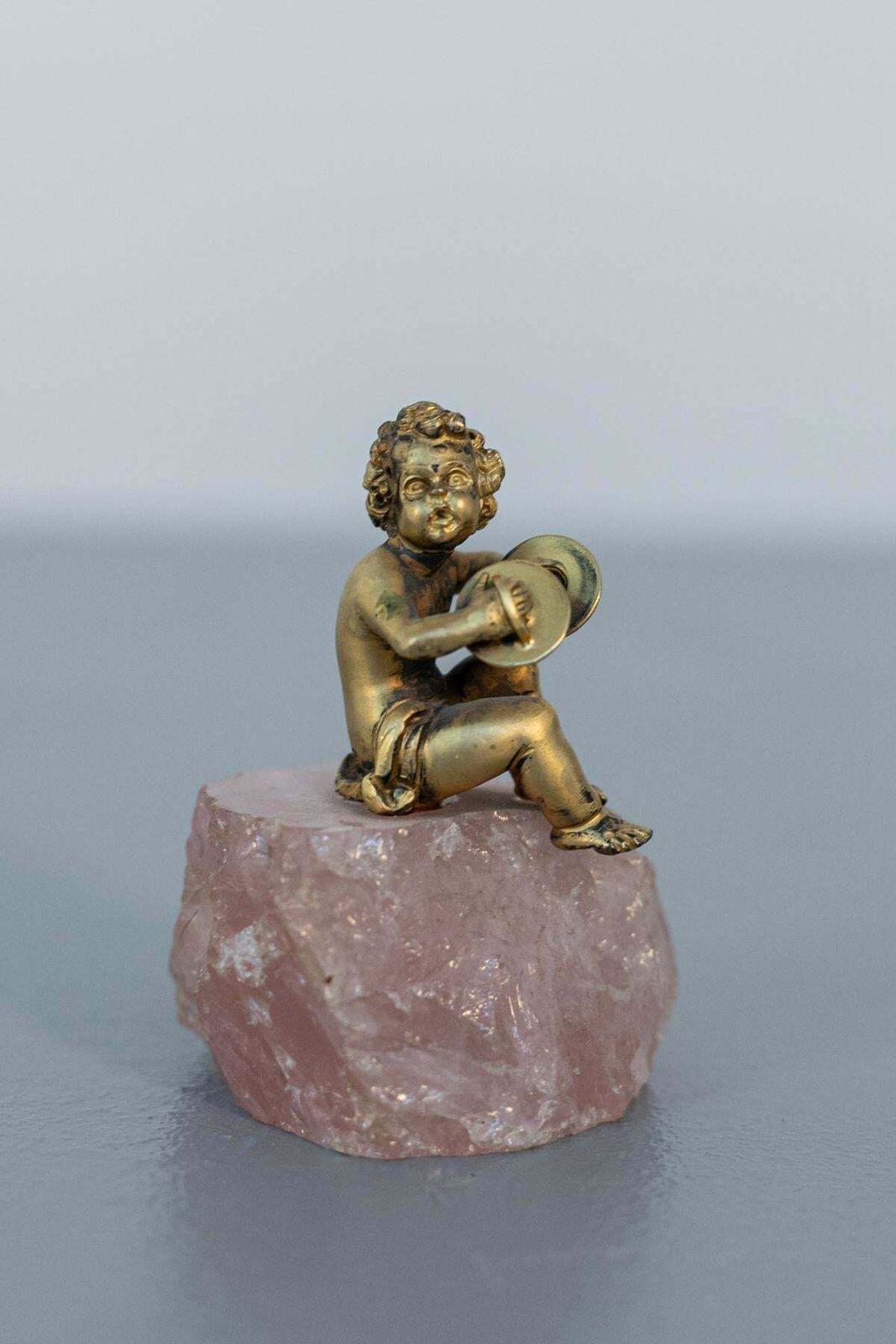 Baroque Statue Of Silver Cherub On Rose Quartz photo furniture
