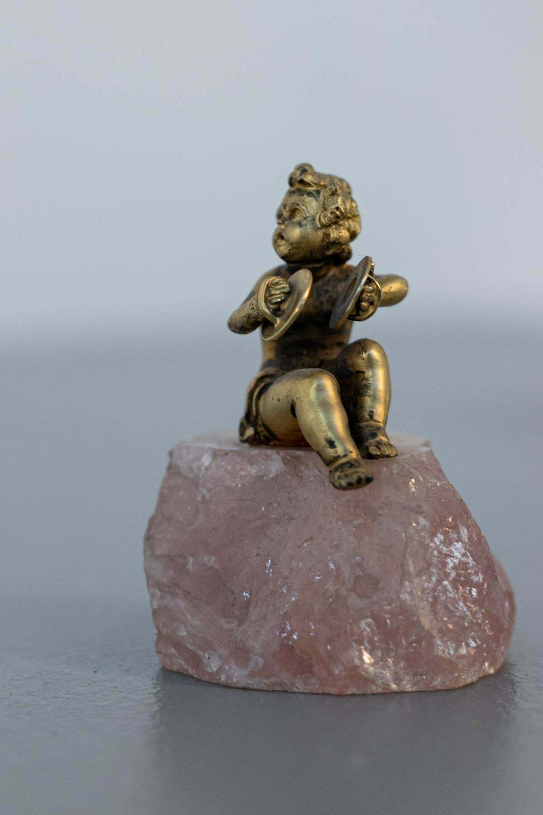 Baroque Statue Of Silver Cherub On Rose Quartz photo buy