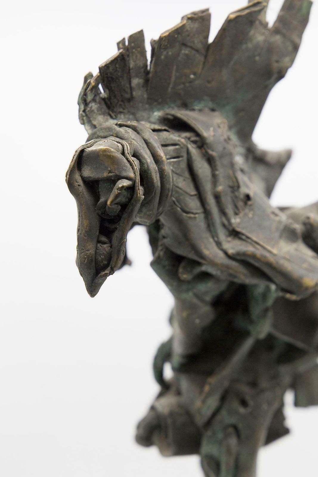 photo furniture Brutalist Bronze Mythological Bird Sculpture In Travertine