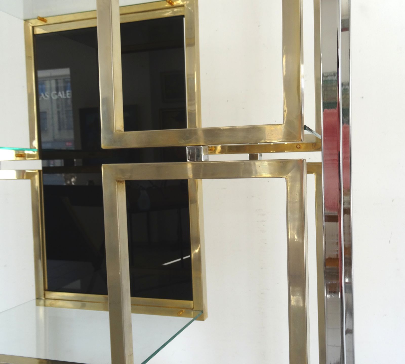 An Illuminating Book Case In Gold And Chromium Plated Aluminium With Black Tinted Glass. photo for sale