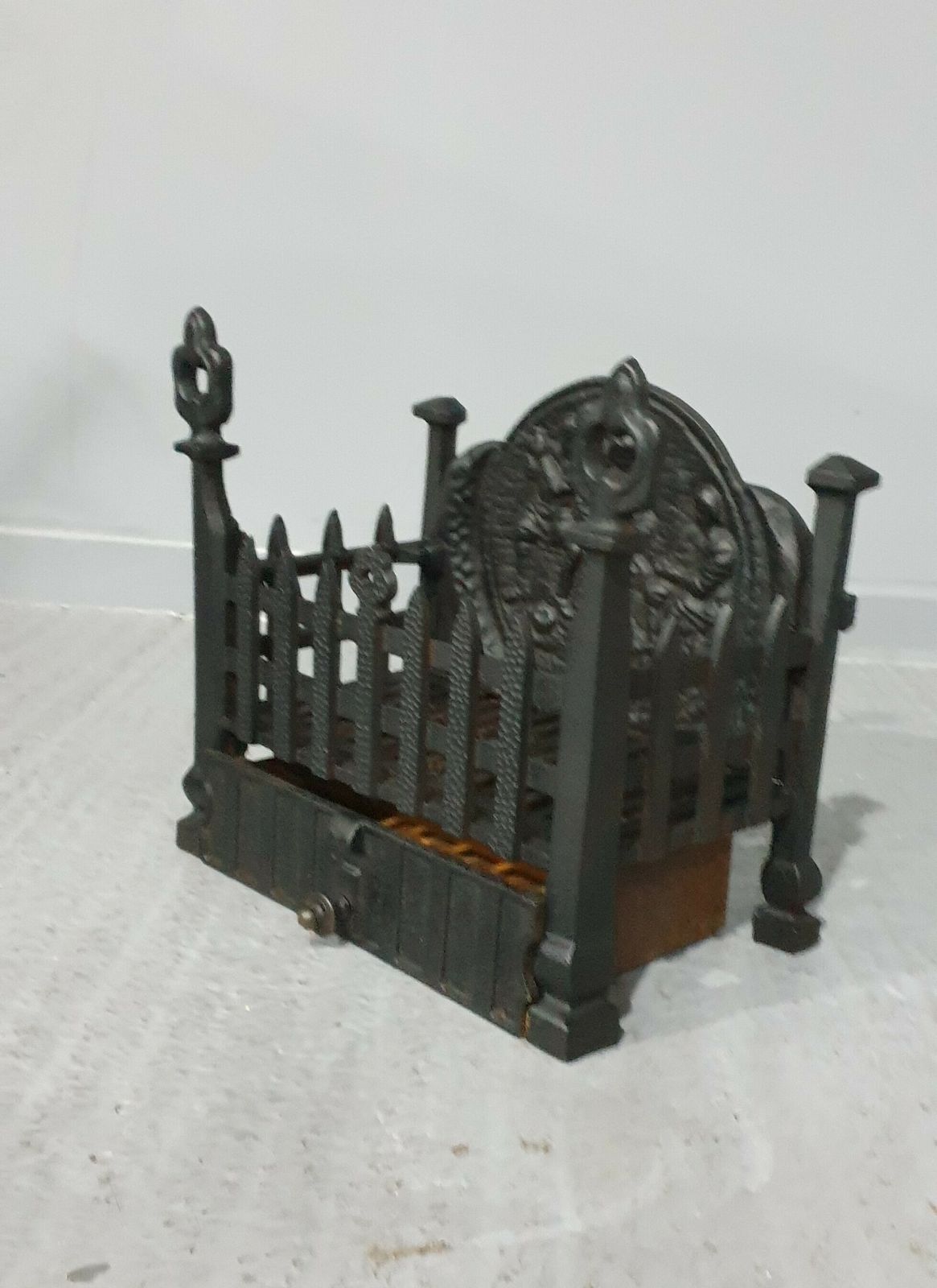 Cast Iron Grate Of Small Proportions photo Home Fixtures