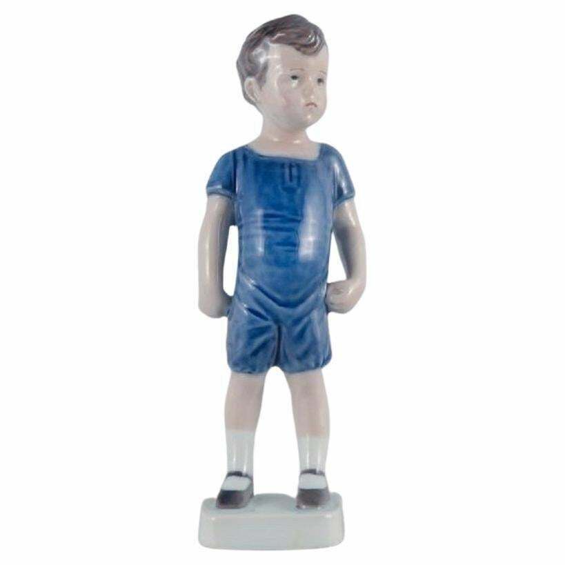 Royal Copenhagen, A Rare Figure Of A Boy. Model Number 519. photo vintage