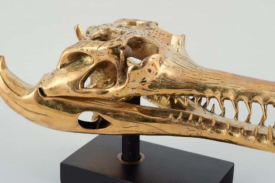 Large Sculpture In Gilded Metal, Modern Design In The Shape Of A Crocodile Skull photo Art