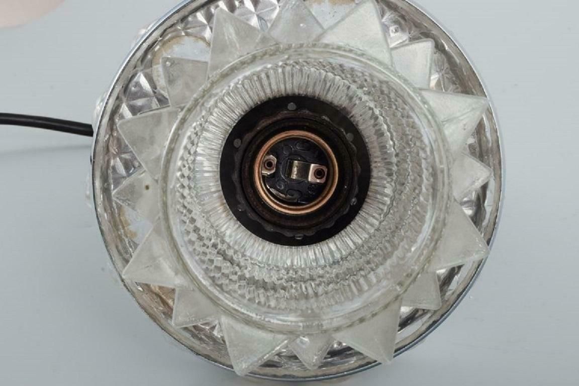 Raak, The Netherlands. Designer Lamp In Chrome, Plastic And Clear Glass. photo vinterior
