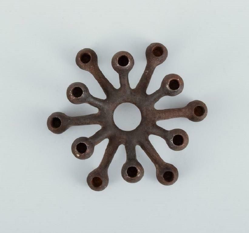 Jens H. Quistgaard, Collection Of Eleven Candlesticks In Cast Iron photo furniture