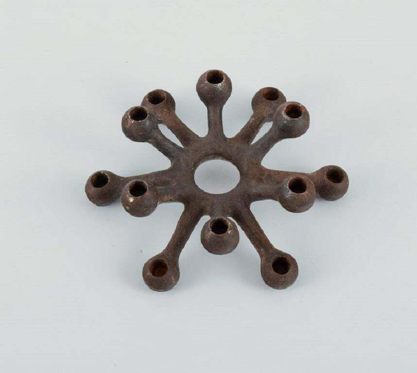 Jens H. Quistgaard, Collection Of Eleven Candlesticks In Cast Iron photo for sale