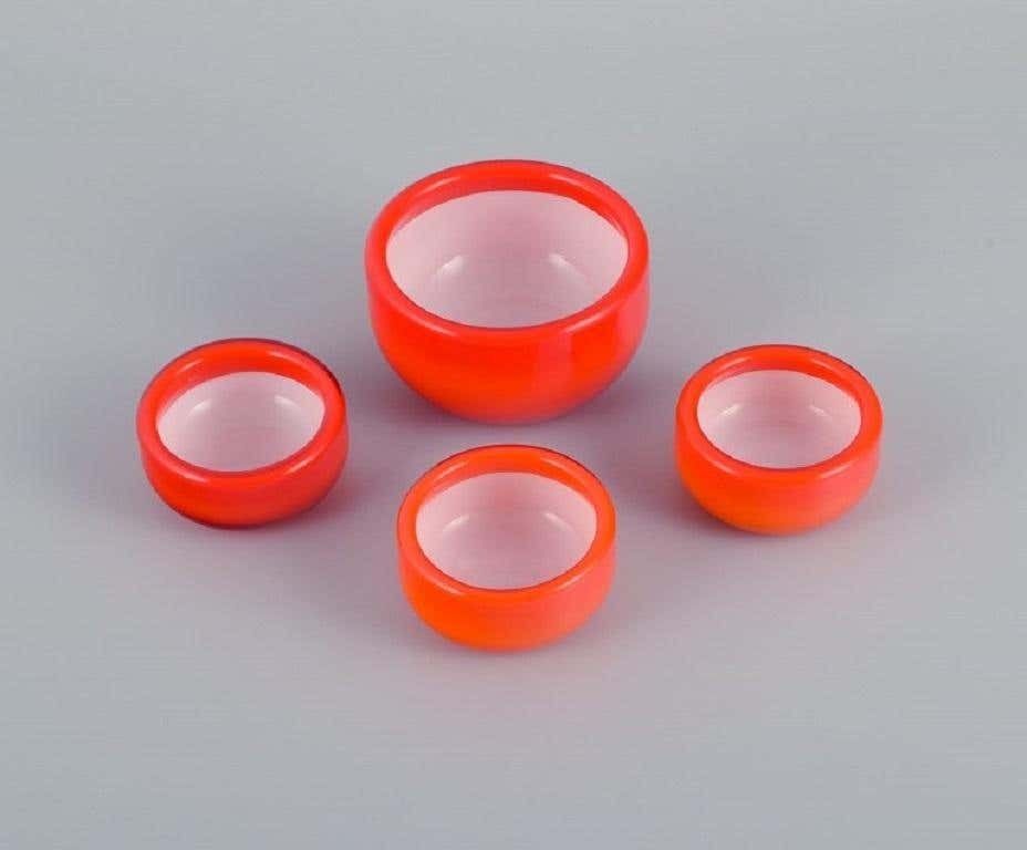 Michael Bang For Holmegaard, Four Glass Bowls In Orange And White Art Glass photo for sale