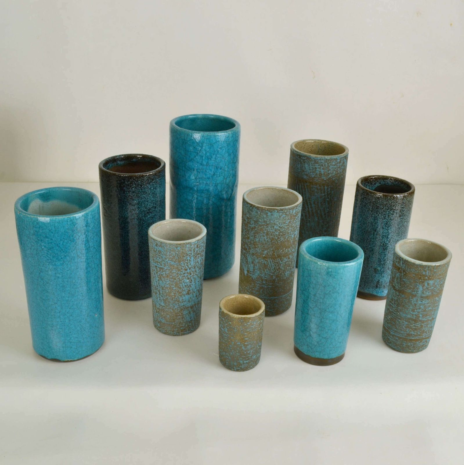 Set Of Ten Blue Ceramic Cylinder Vases By Groeneveldt photo furniture