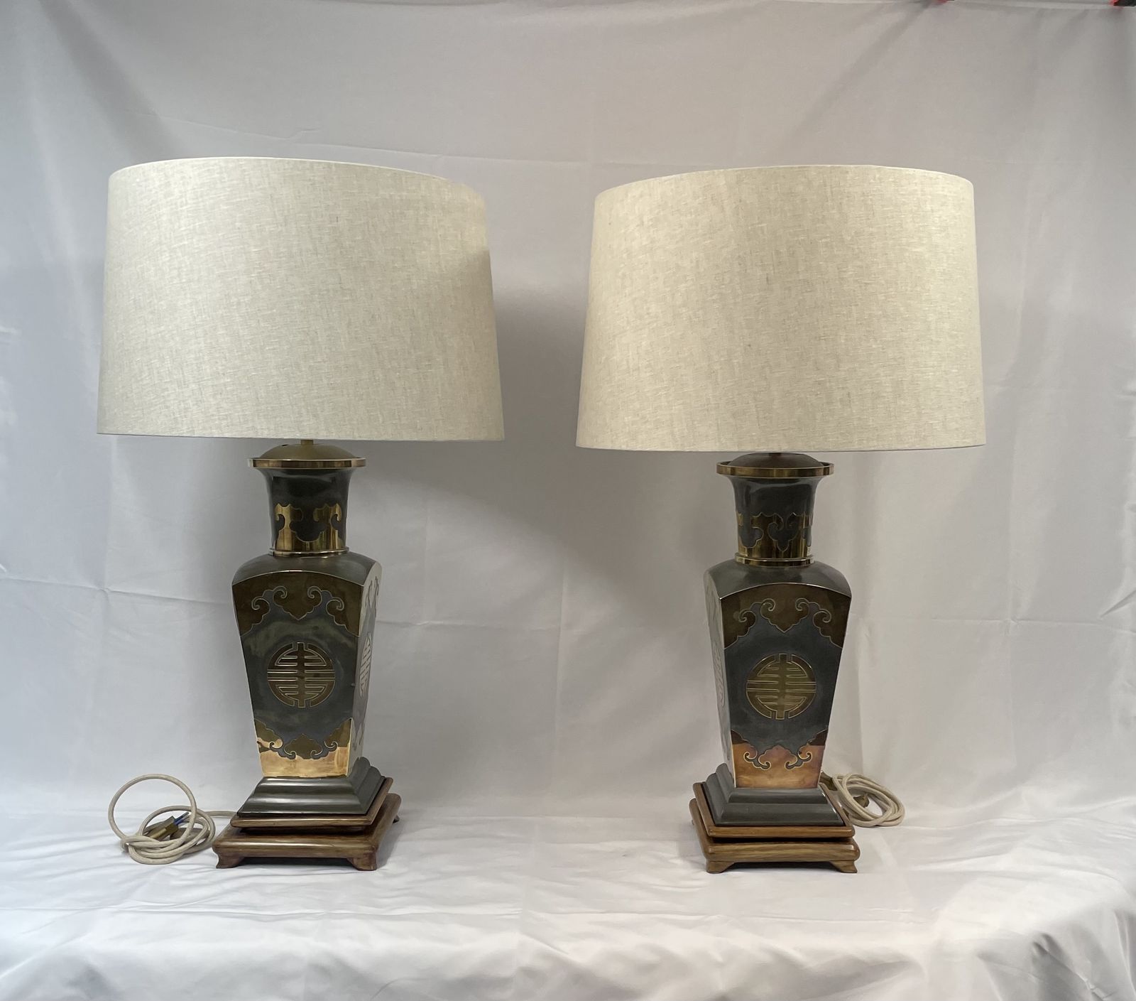 Pair Of Metal Lamps With Brass Applications On Wooden Bases.  50's photo furniture