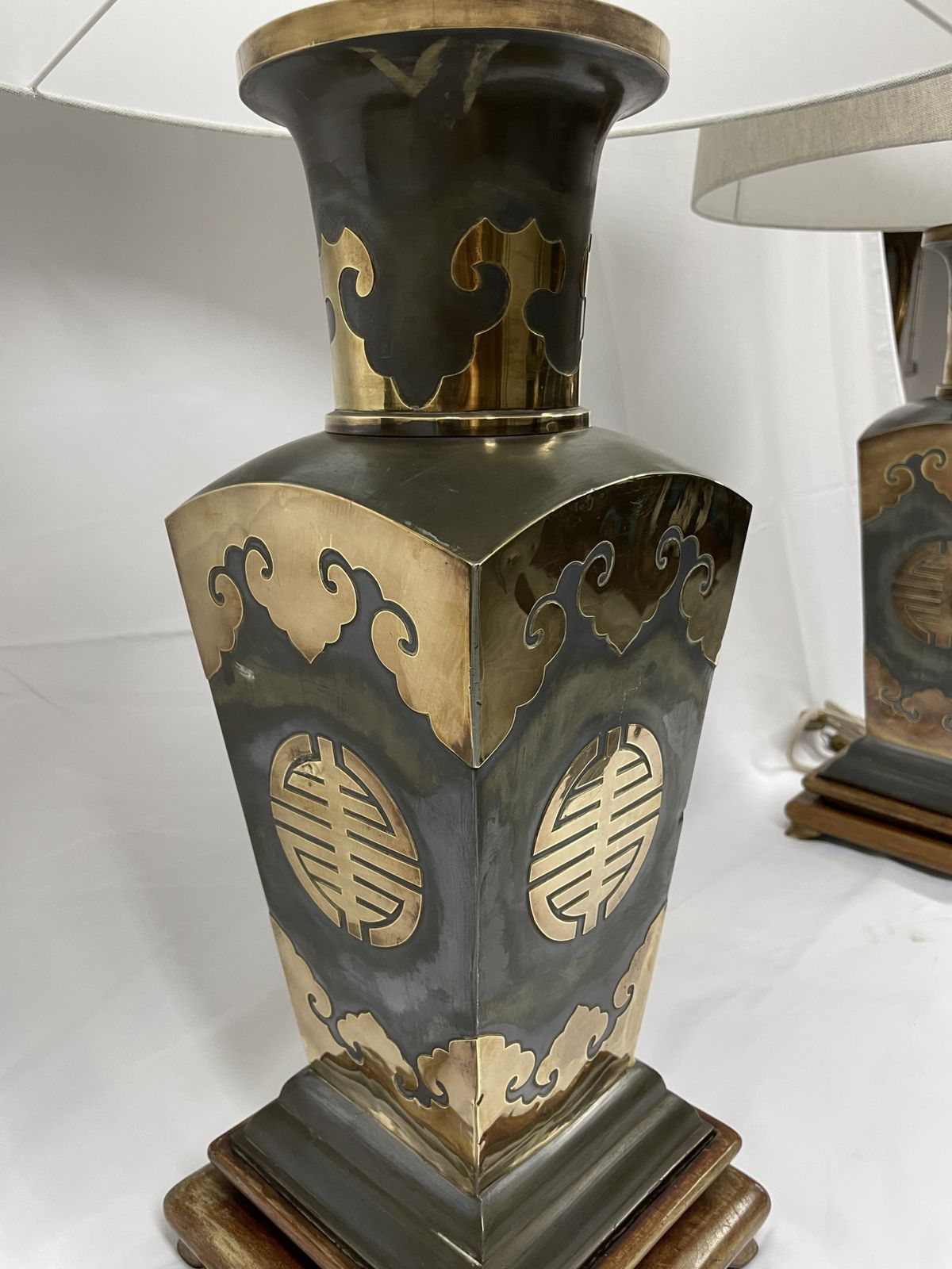 Pair Of Metal Lamps With Brass Applications On Wooden Bases.  50's photo vintage