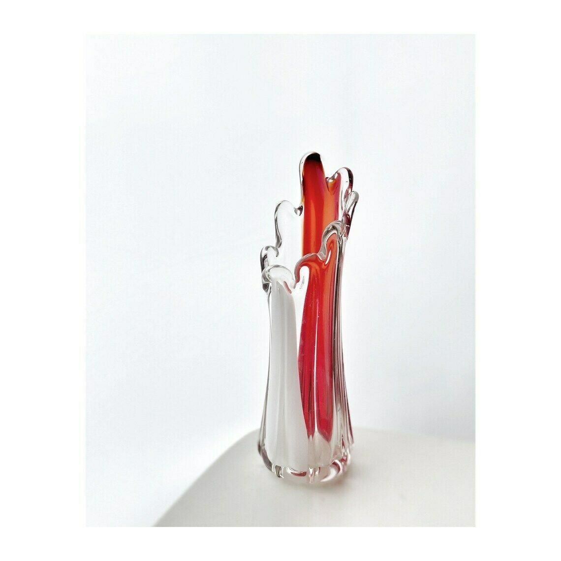 A Murano Art Glass Vase, Organic Form, Clear With White, And Red Tint