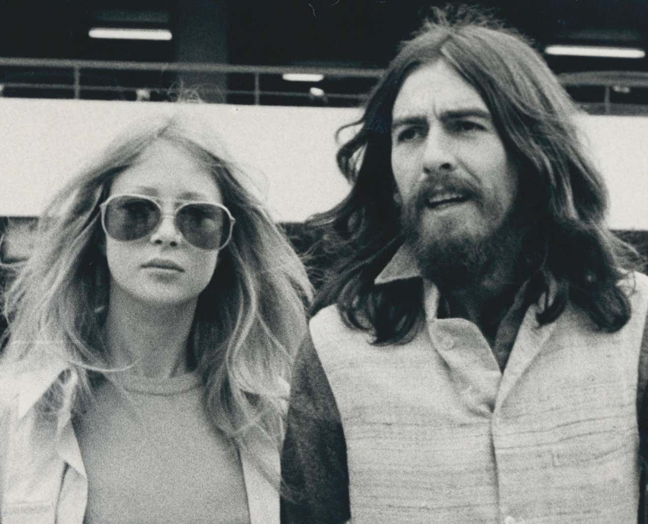 Black And White Photograph Of George Harrison And His Partner photo furniture
