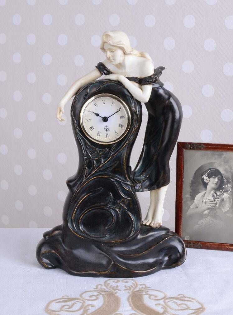 Antique Still Decorative Mantel Clock In The Romantic Art Nouveau Style. photo furniture