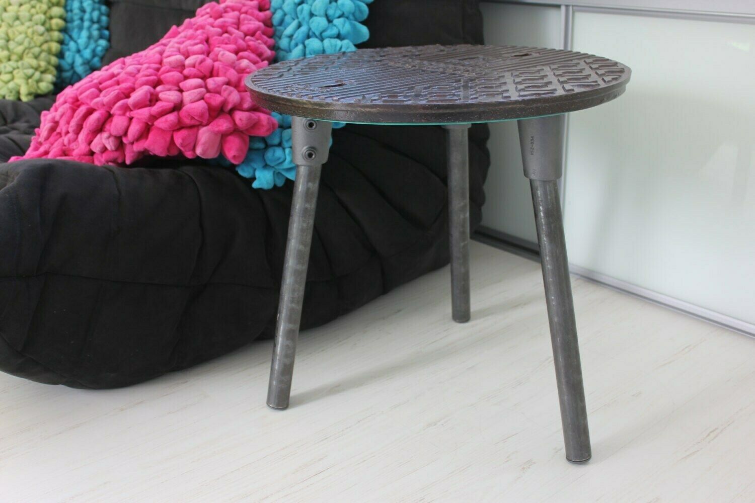 Jeremy Reclaimed Manhole Cover Side Table With 3 Splayed Dark Steel Legs And Bright Viridian Underside photo furniture
