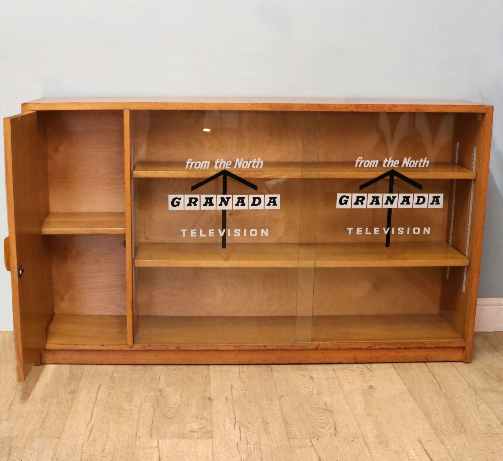 A Mid Century Light Oak Veneered Bookcase Later Sign Written For The Granada Television photo buy