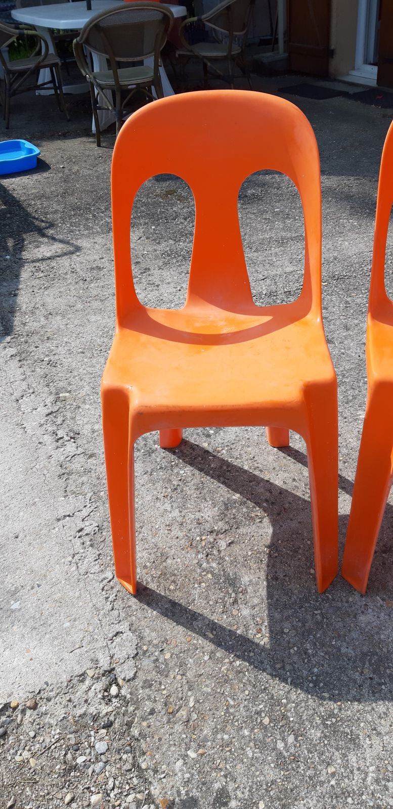 12 Stackable Orange Plastic Chairs photo furniture