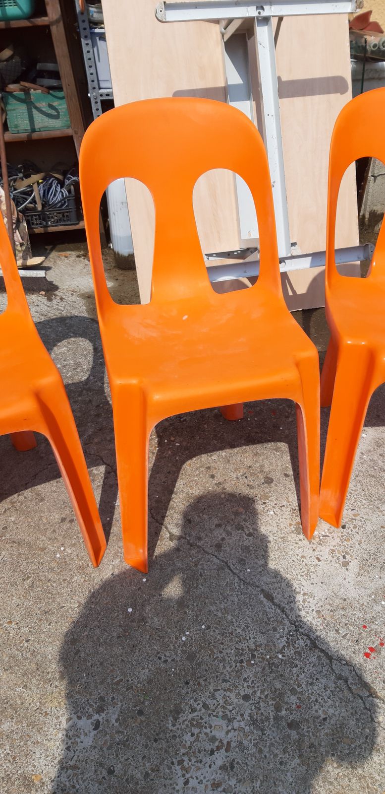 Furniture 12 Stackable Orange Plastic Chairs photo