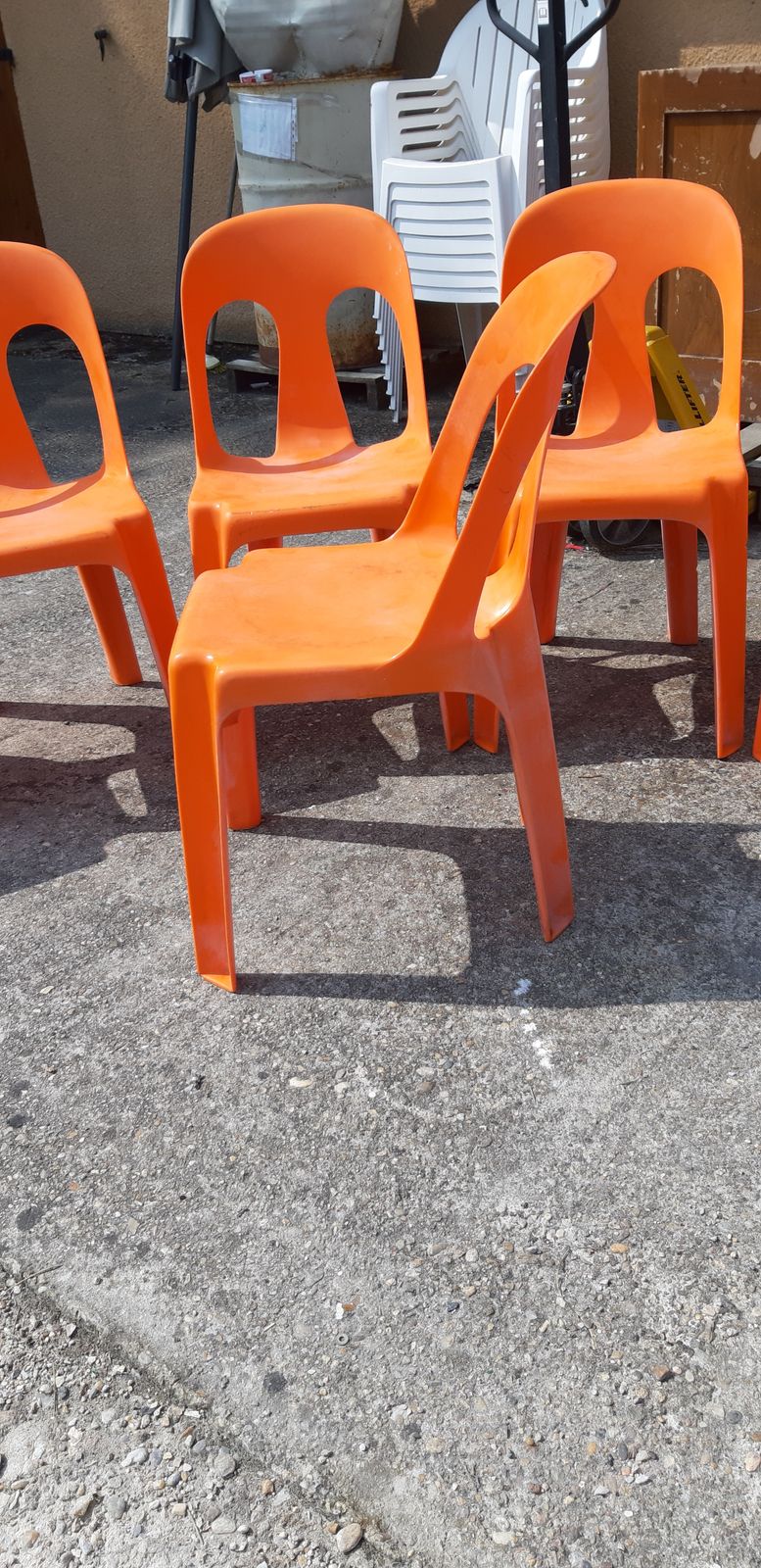 photo vintage 12 Stackable Orange Plastic Chairs