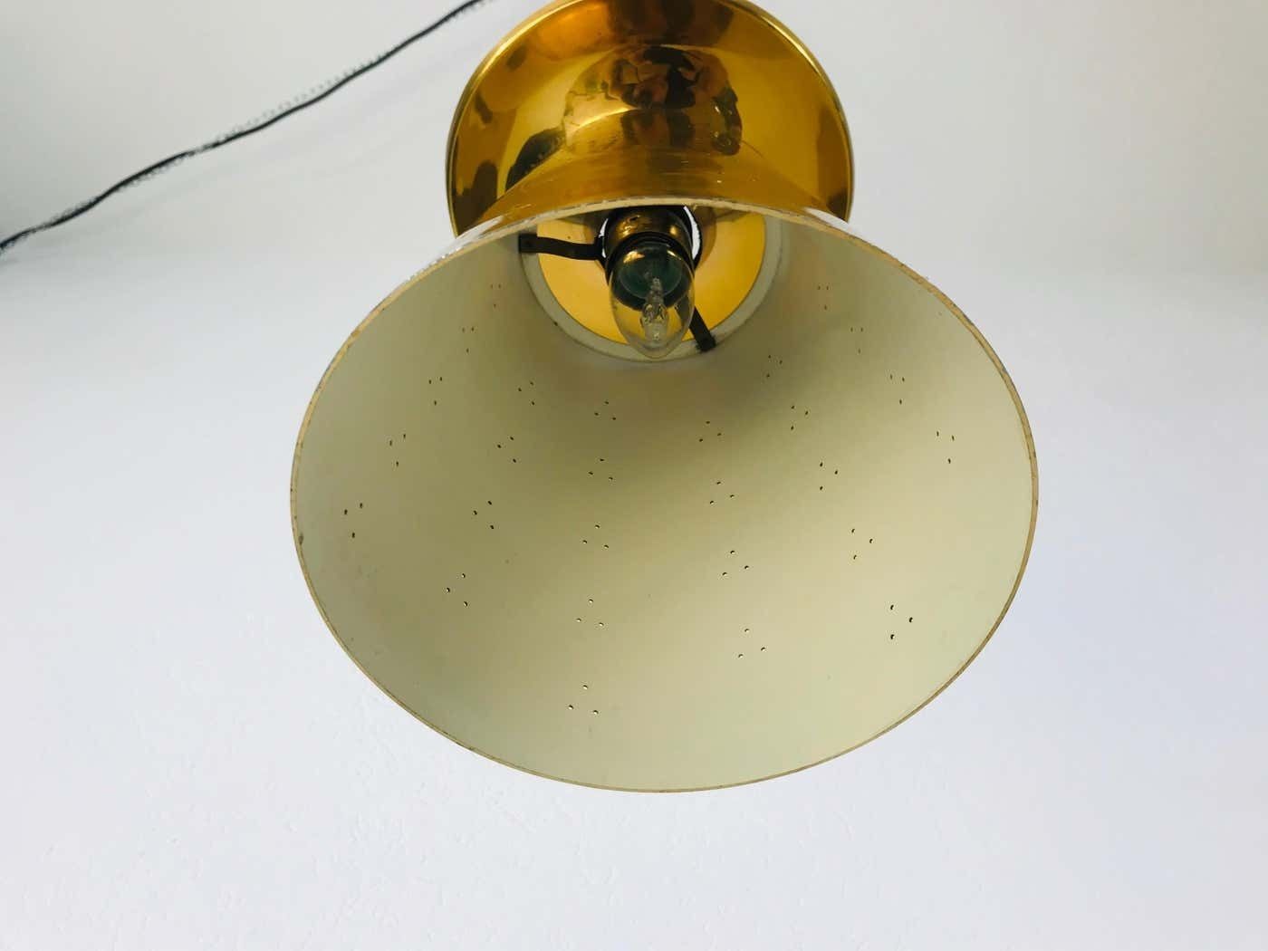 photo vintage Set Of 3 Polished Brass Pendant Lamps Attributed To Paavo Tynell, 1950s