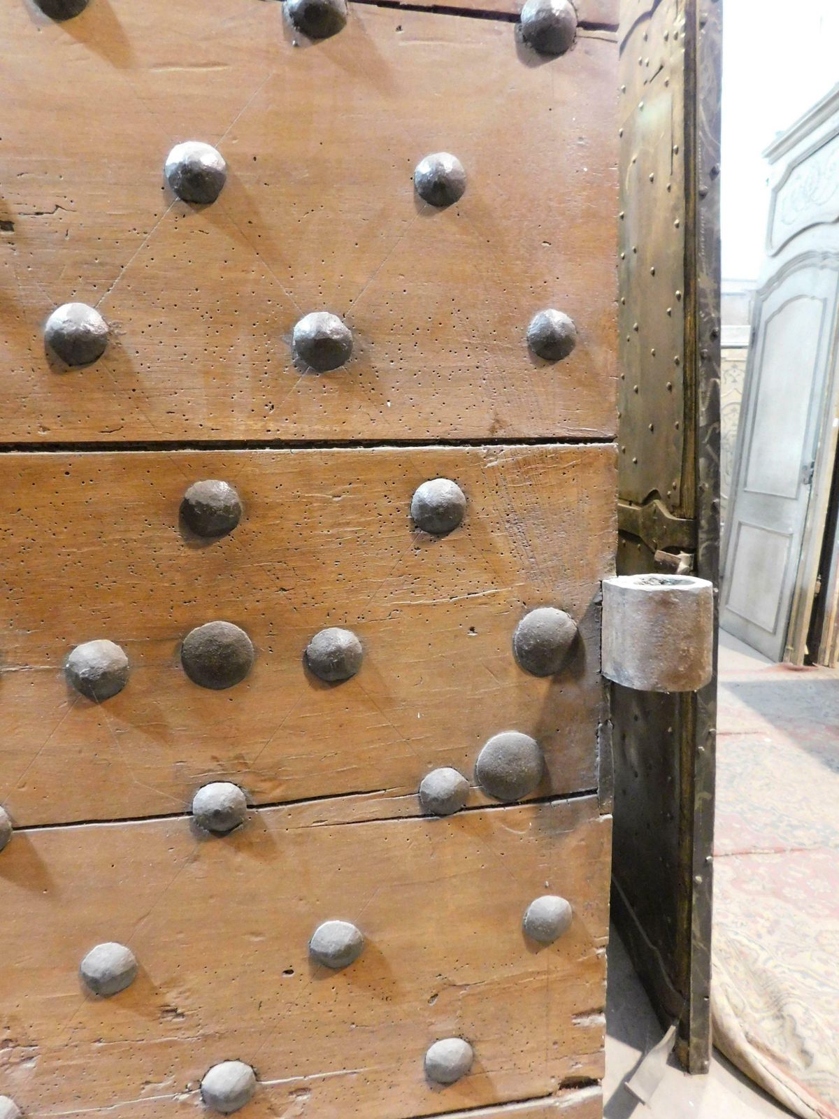 Old Rustic Entrance Door In Walnut With Nails, From Northern Italy photo vinterior
