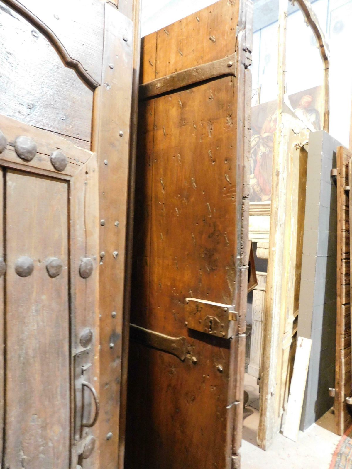 Old Rustic Entrance Door In Walnut With Nails, From Northern Italy photo vintage