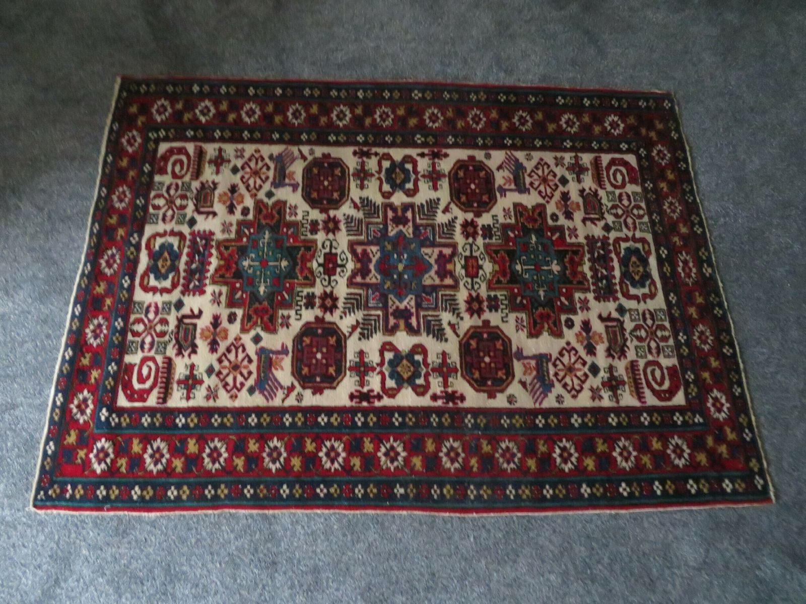 photo vintage Antique Caucasian Erivan Armenian Rug. Plethora Of Tribal Motifs Including Snakes. 152cm X 112cm.