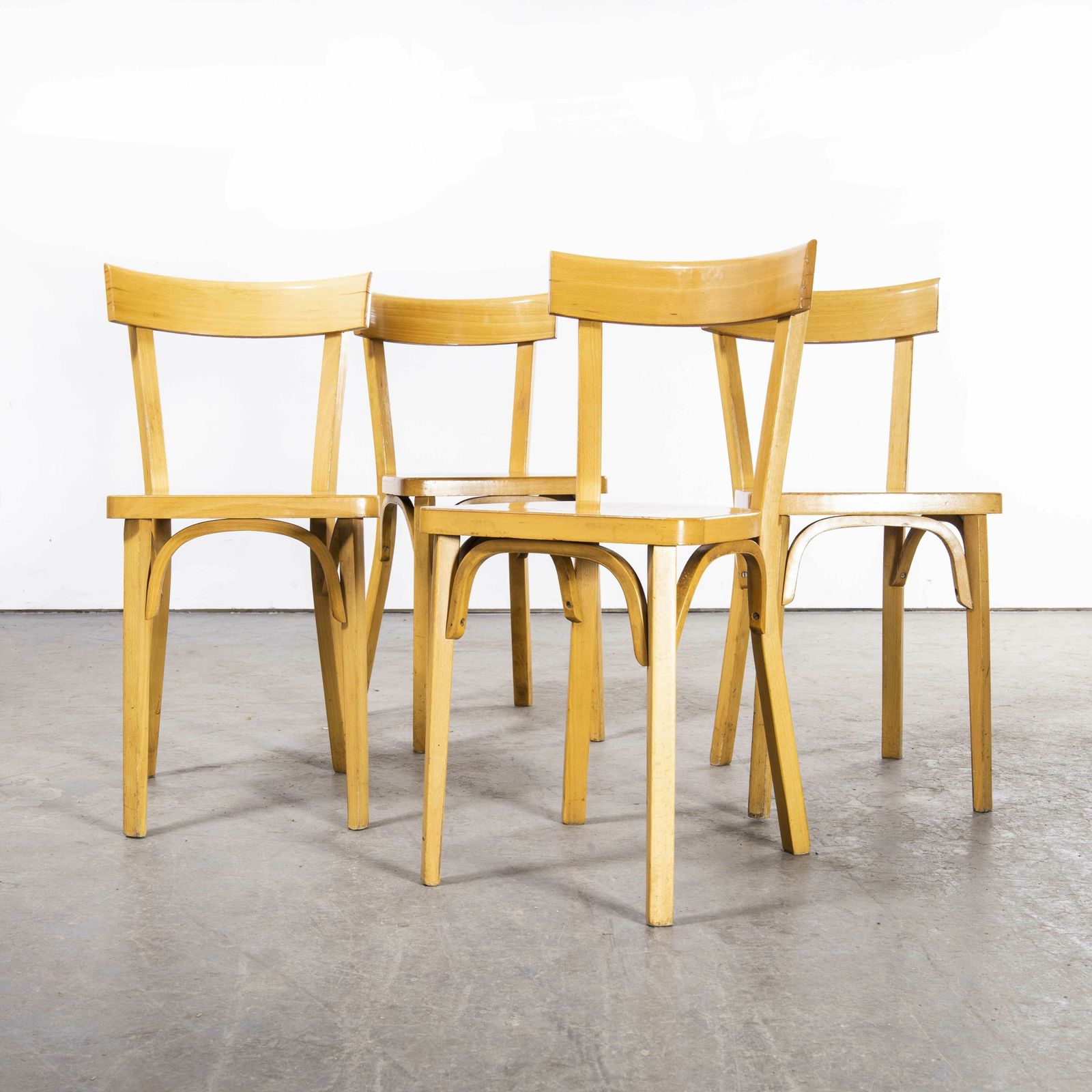1950’s French Baumann Blonde Slim Back Bentwood Dining Chairs – Set Of Four