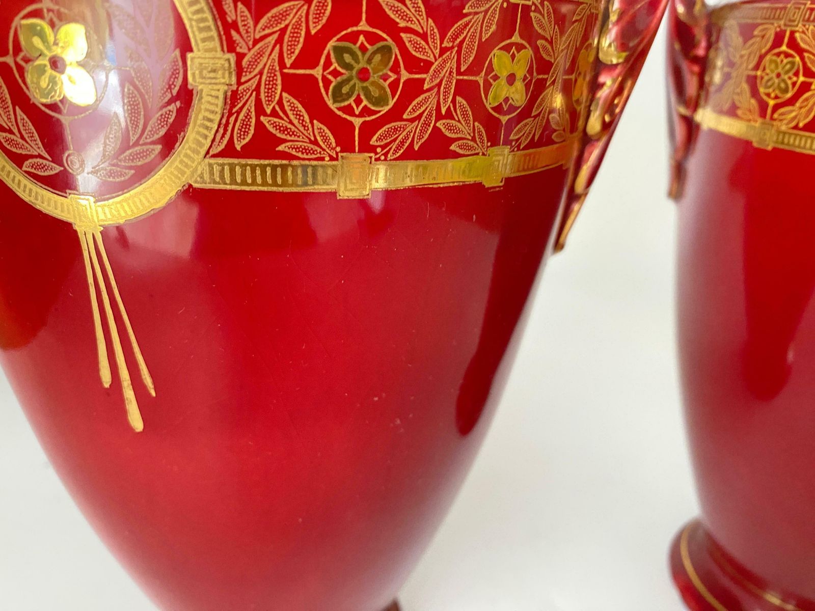 photo furniture Pair Of Red Cobalt Urns Vase With Ceramic Handles And Gilted Decorations