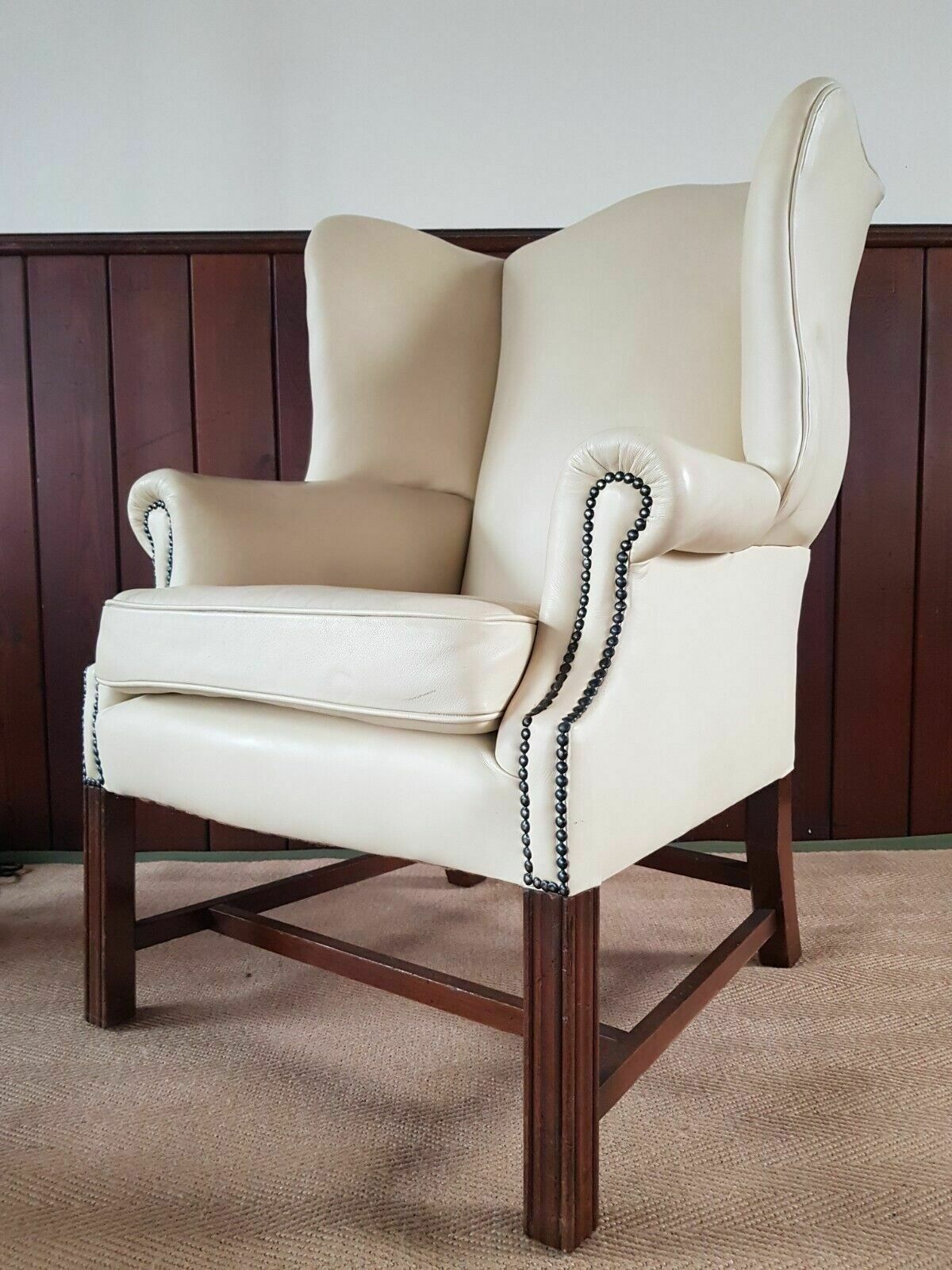 A Reupholstered Leather George III Style Wingback Armchair