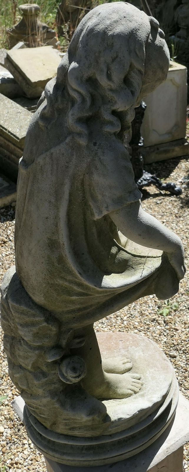 Statue Of A Girl Holding Out Her Apron photo buy