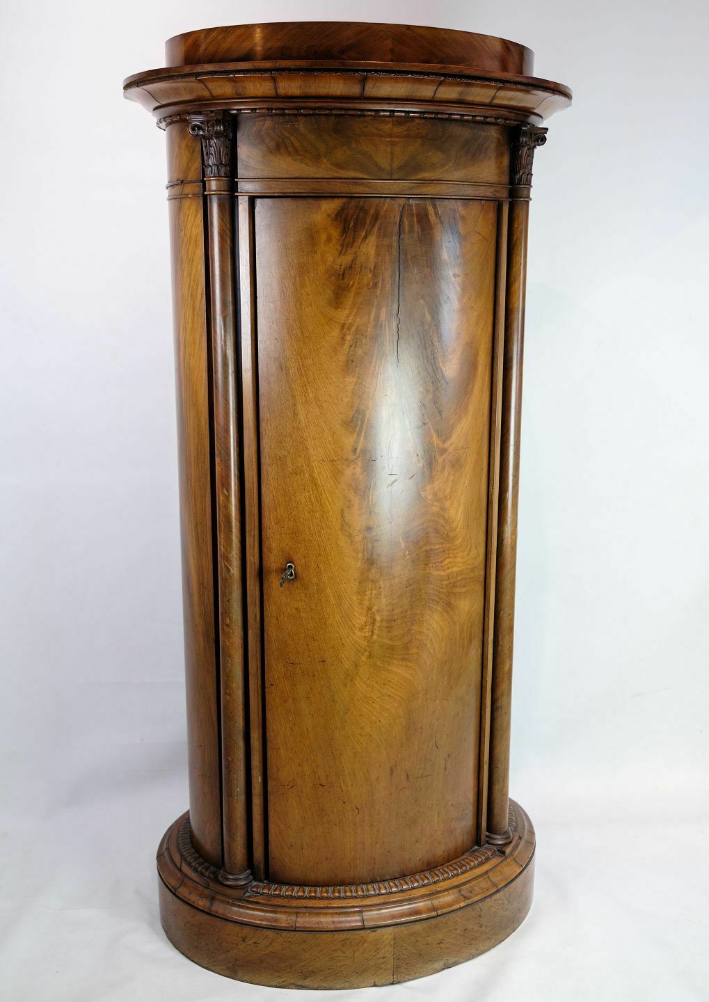 Oval Pedestal Cabinet With Mahogany Carvings From 1820s