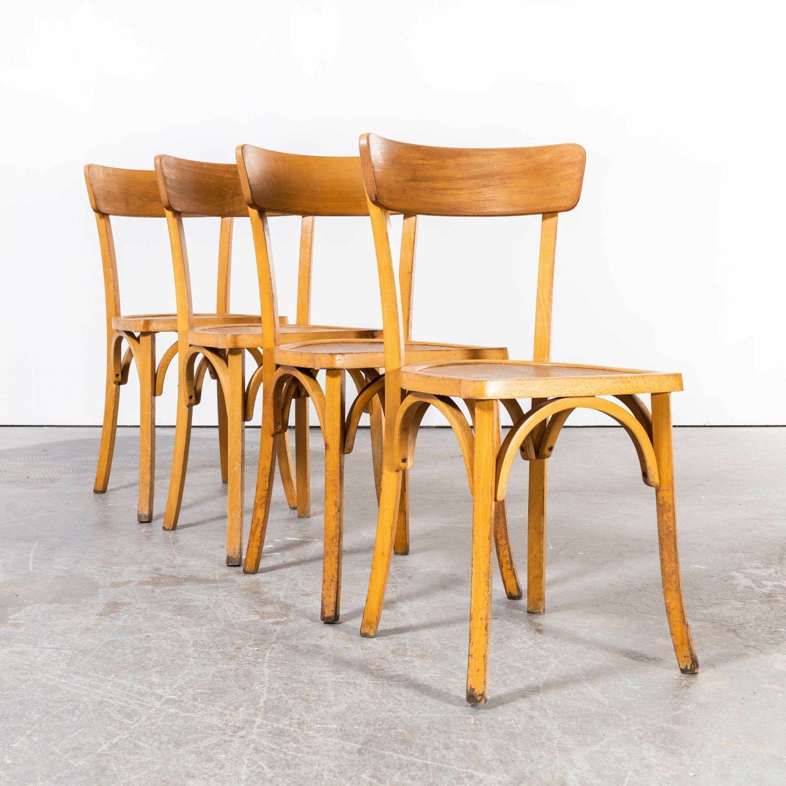 1950’s French Baumann Blonde Kick Leg Bentwood Dining Chairs – Set Of Four