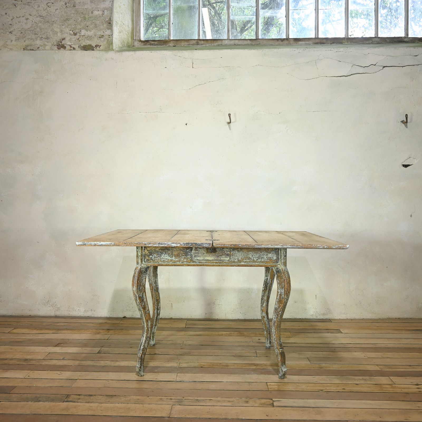 photo furniture A 19th Century French Painted Swivel Top Dining Table