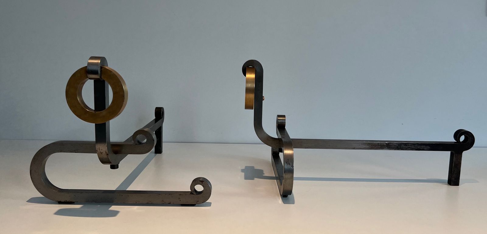 Pair Of Modernist Andirons In Chromed Steel, Brass And Wrought Iron photo for sale