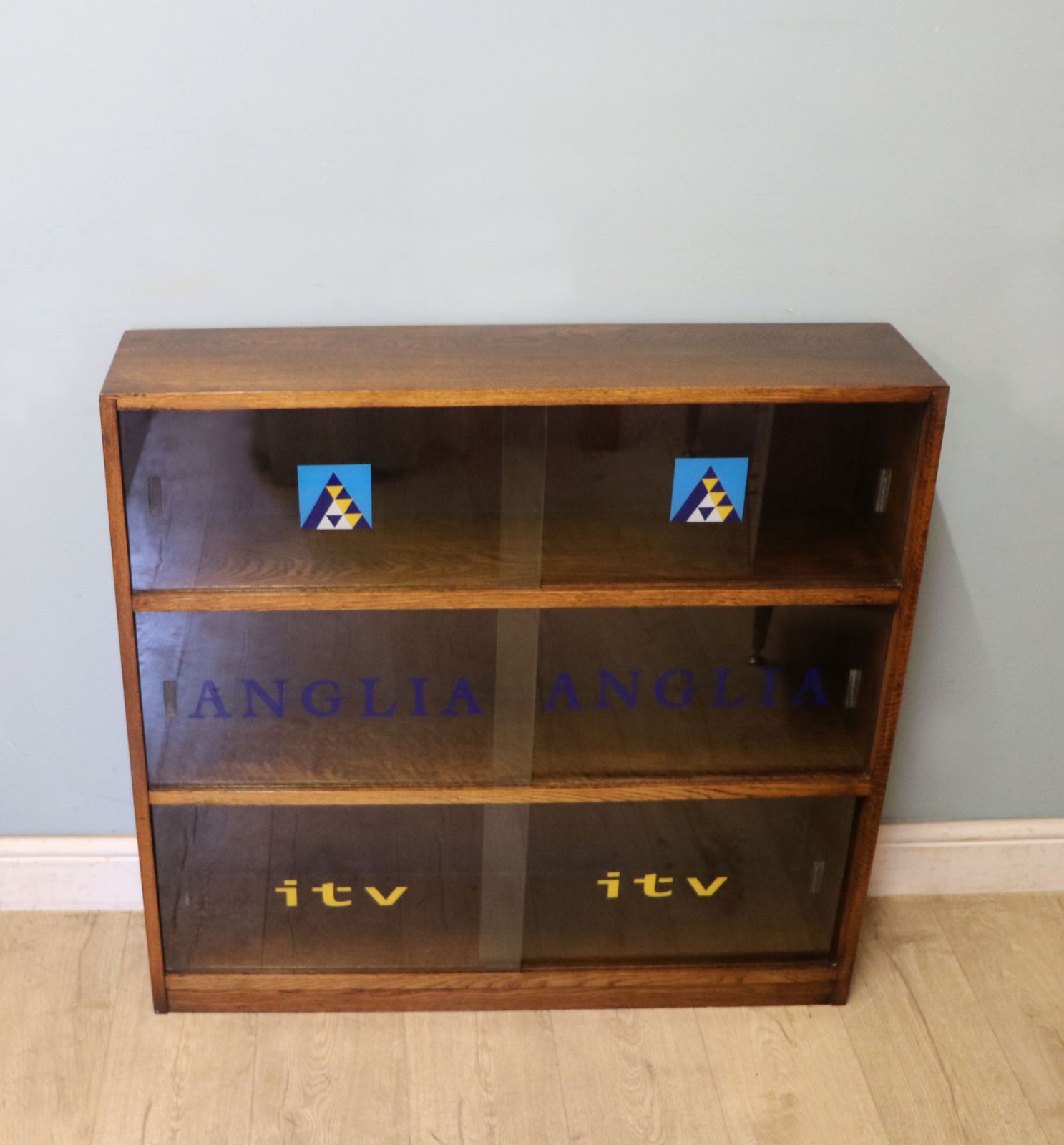 A Lovely Retro Mid Century Display Cabinet Later Sign Written For Anglia Television.