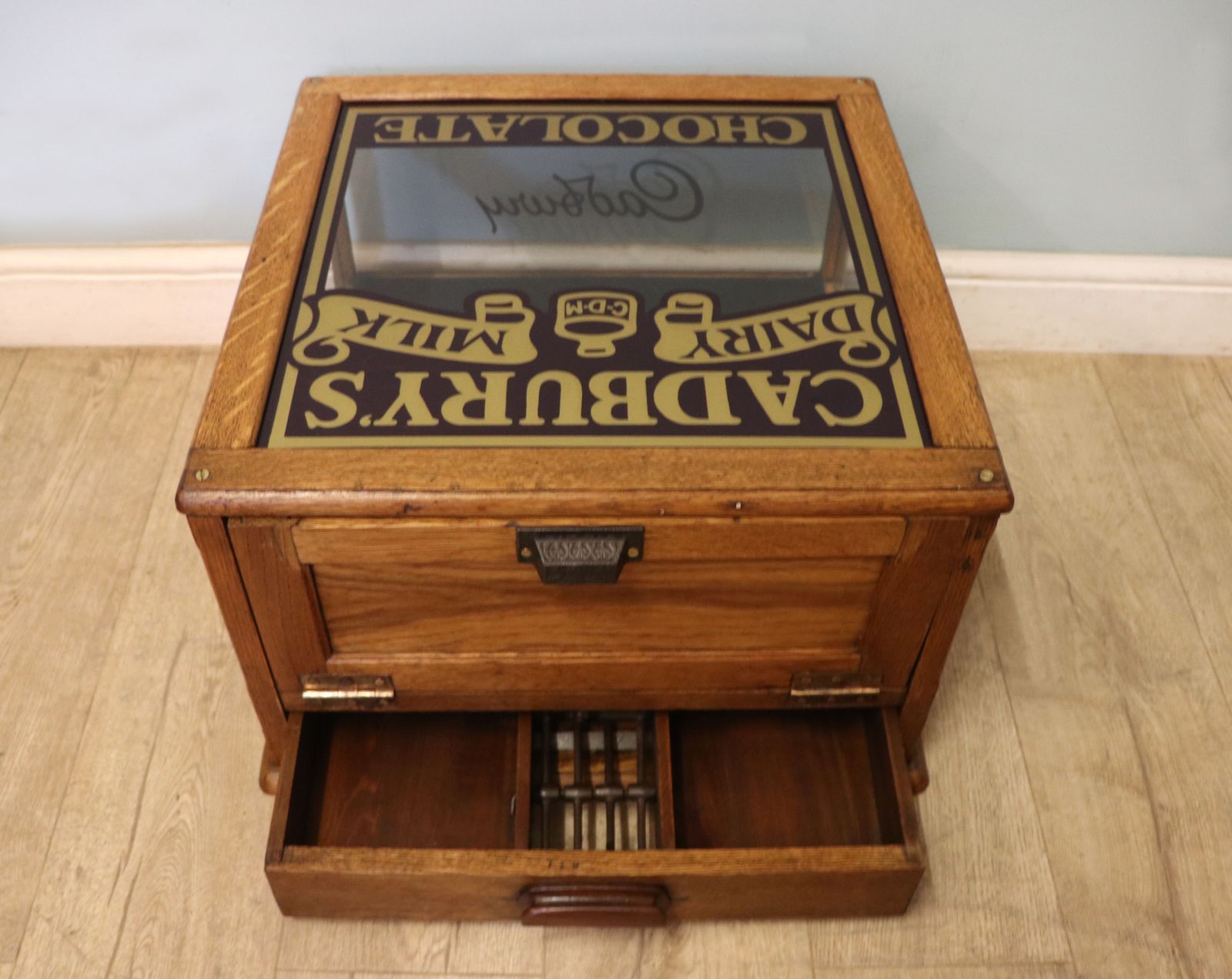 photo for sale A Lovely Early 20th Century Oak Countertop Display Cabinet, Later Sign Written For Cadburys Chocolate.