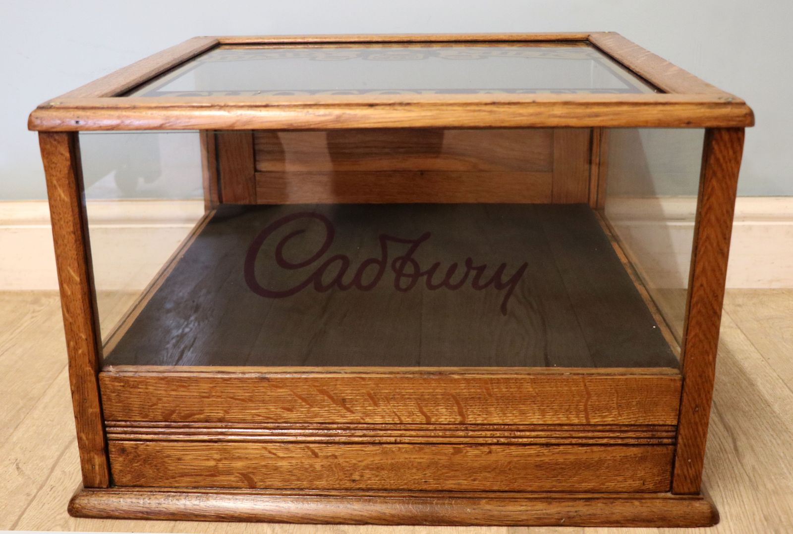 photo vinterior A Lovely Early 20th Century Oak Countertop Display Cabinet, Later Sign Written For Cadburys Chocolate.