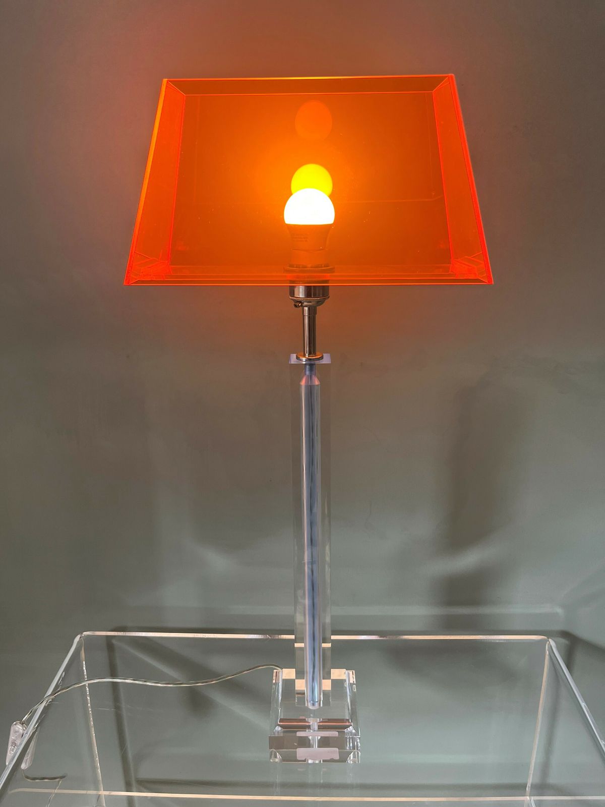 Early 21st Century Italian/English Acrylic Table Lamp With A Translucent Orange Acrylic Shade
