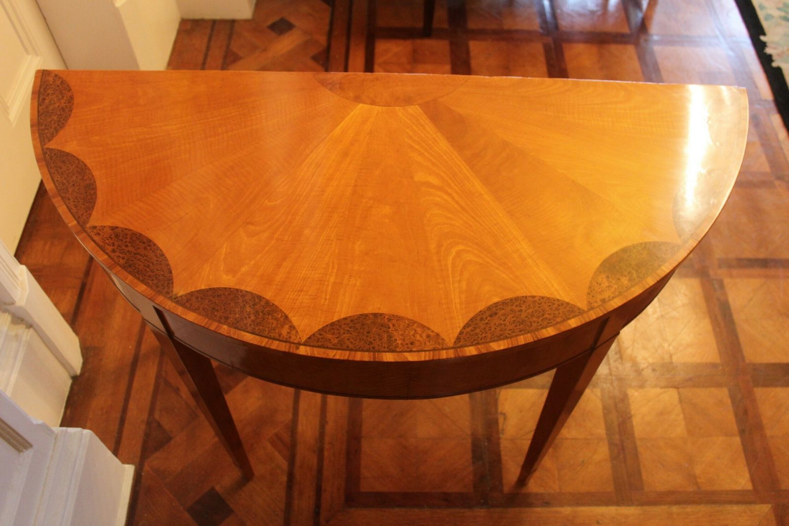 photo furniture An Early 19th Century Satinwood Demi Lune Console Table