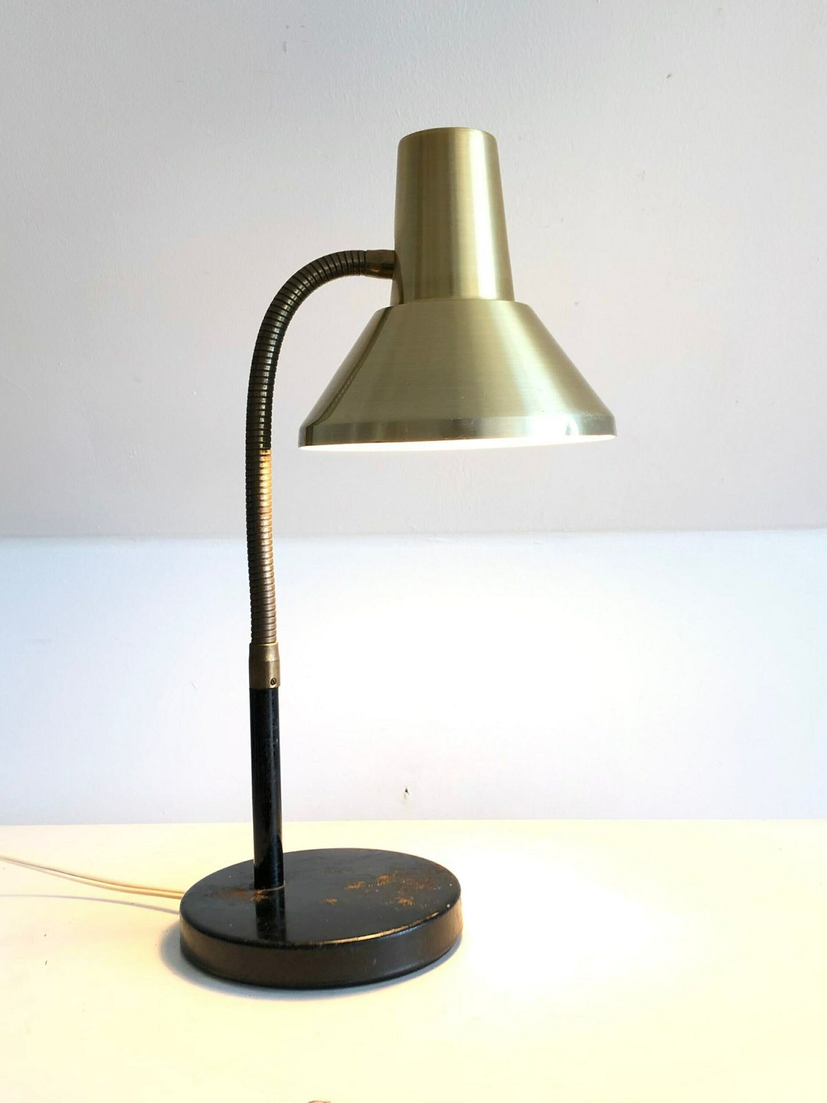 Vintage Classic Table Lamp In Cool Design With Golden Shade, Flexible Brass Neck And Patinated Black Metal Base photo Lighting