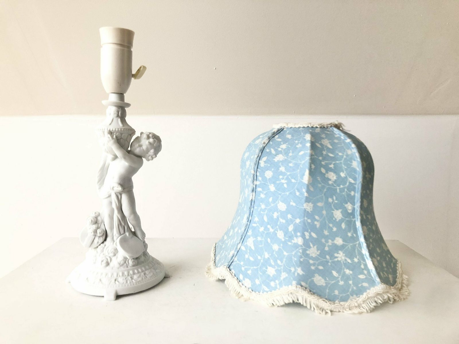Mid Century Beautiful German Porcelain Table Lamp With Motive Of Child Surrounded By Flowers And A Vintage Blue Shade With Flower Pattern photo vinterior