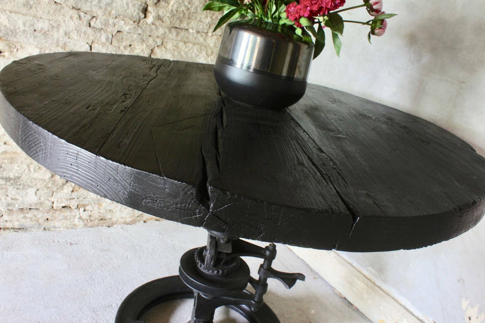 Shift Reclaimed Chunky Scorched Timber Circular Table With A Heavy Pedestal Base Made Out Of An Old Gear System photo vintage