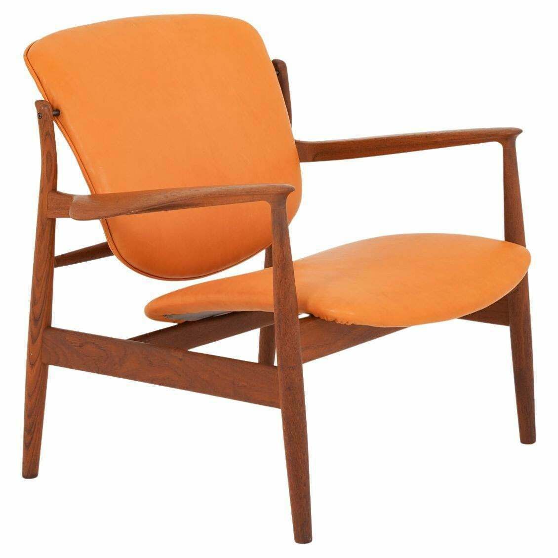 photo furniture Finn Juhl Cognac Leather And Teak Lounge Chair Model Fd 136
