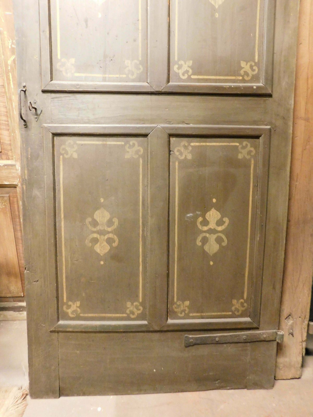 photo furniture Old Door With 4 Painted Panels, Yellow Decorations On Green Background, Italy