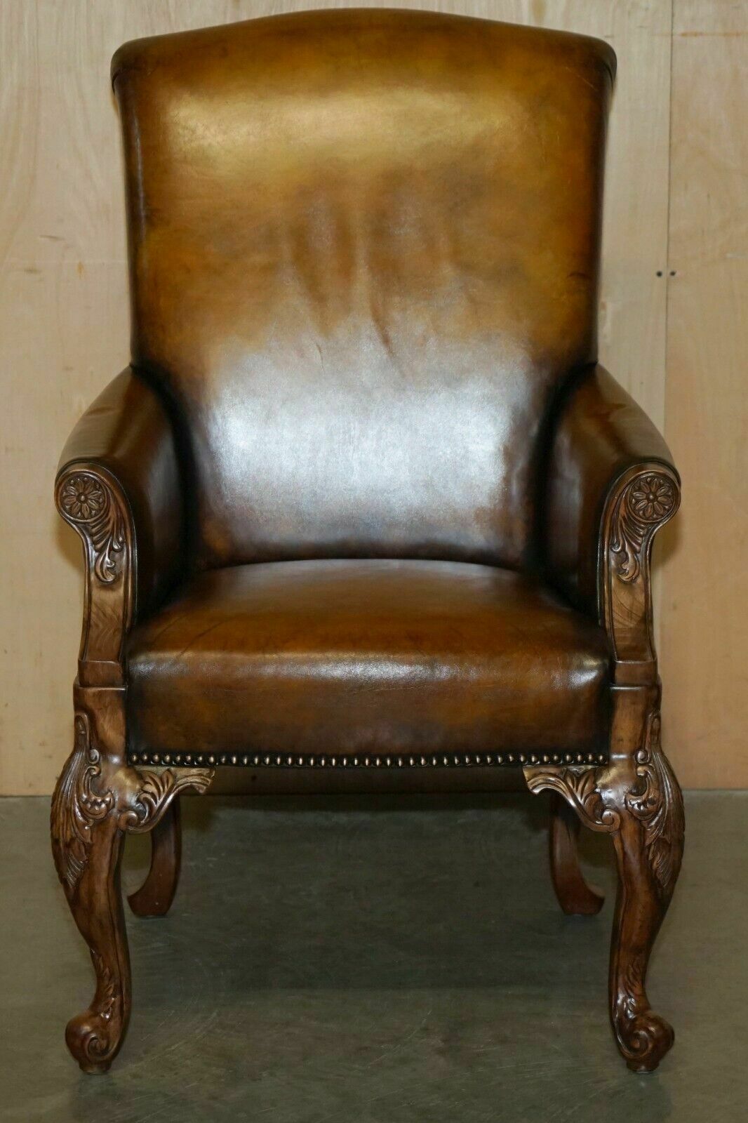 Pair Of Antique Heavily Carved Hand Dyed Brown Leather Restored Throne Armchairs photo for sale