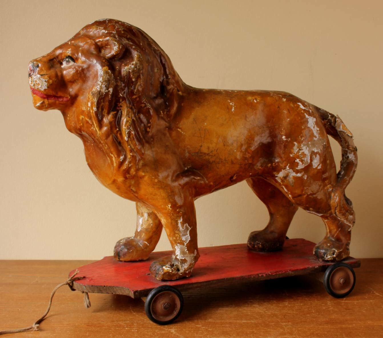 French Pull Along Lion. Paper Mache Model Animal Decorative Toy Trolley. photo buy