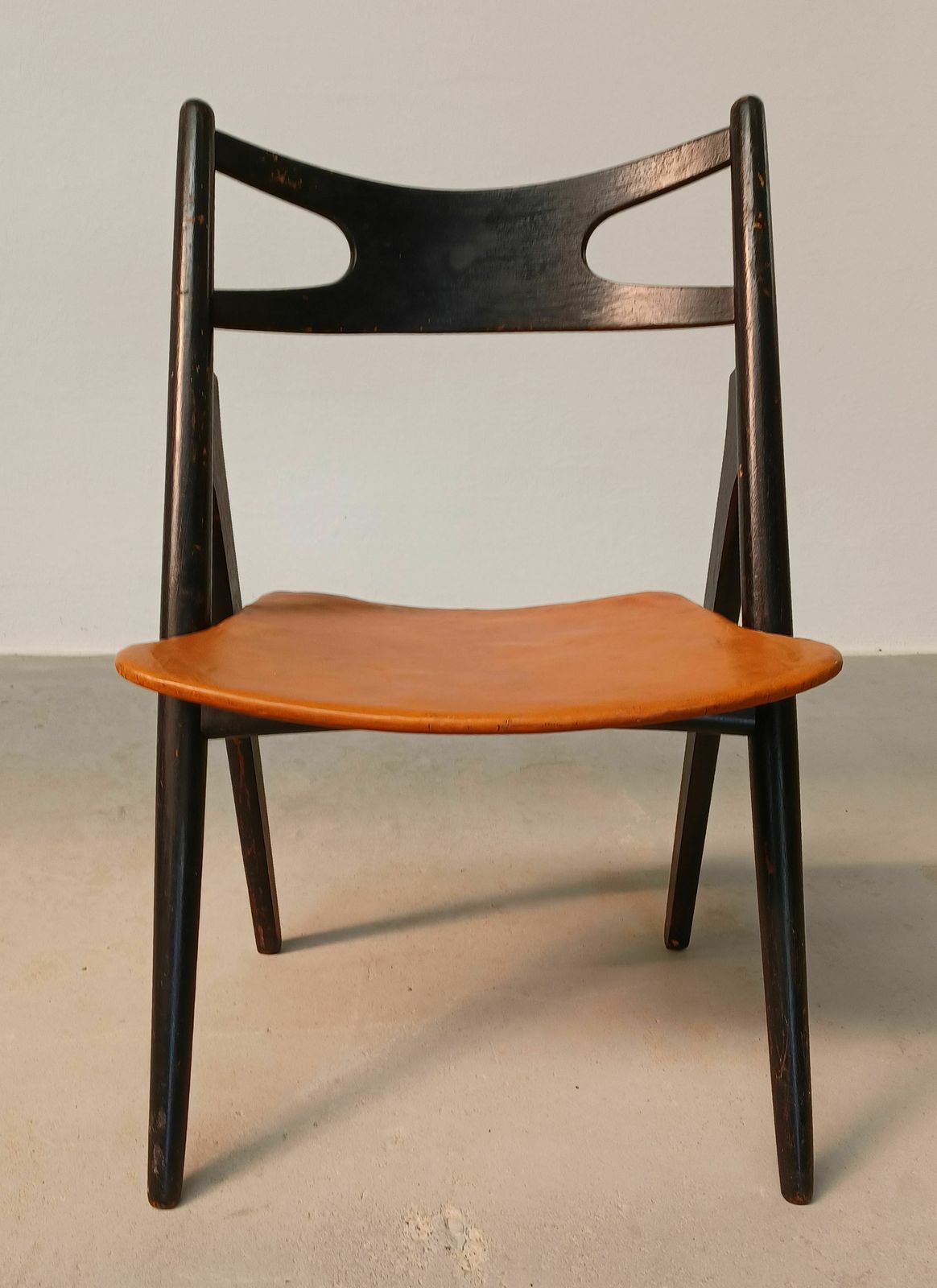 Patinated Hans Wegner Sawbuck Chair With Original Leather 1950s photo furniture