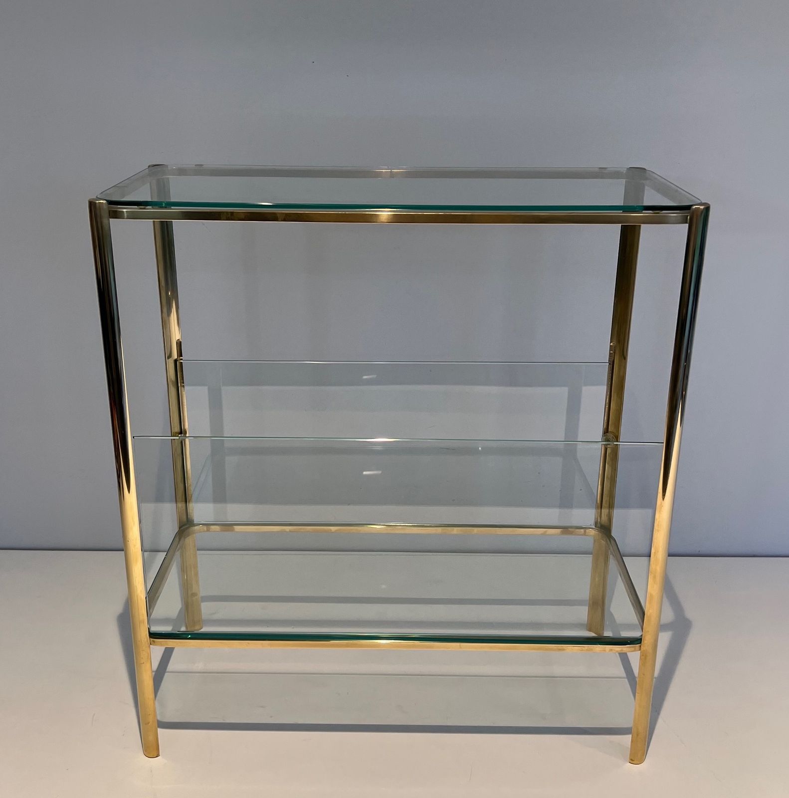 Magazine Rack In Polished Bronze And Glass Signed Jacques Théophile Lepelletier And Stamped Broncz photo Furniture