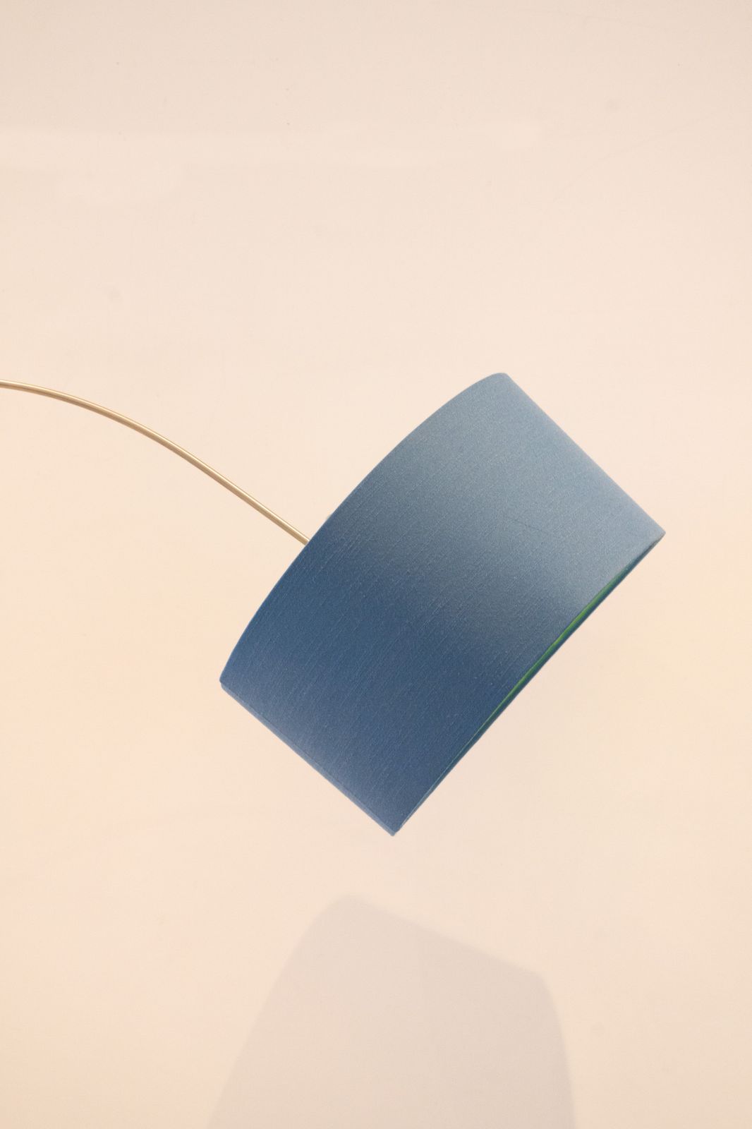 Standard Lamp With Blue Shade With Green Interior Over Arched Shaft To A U Shape photo Lighting