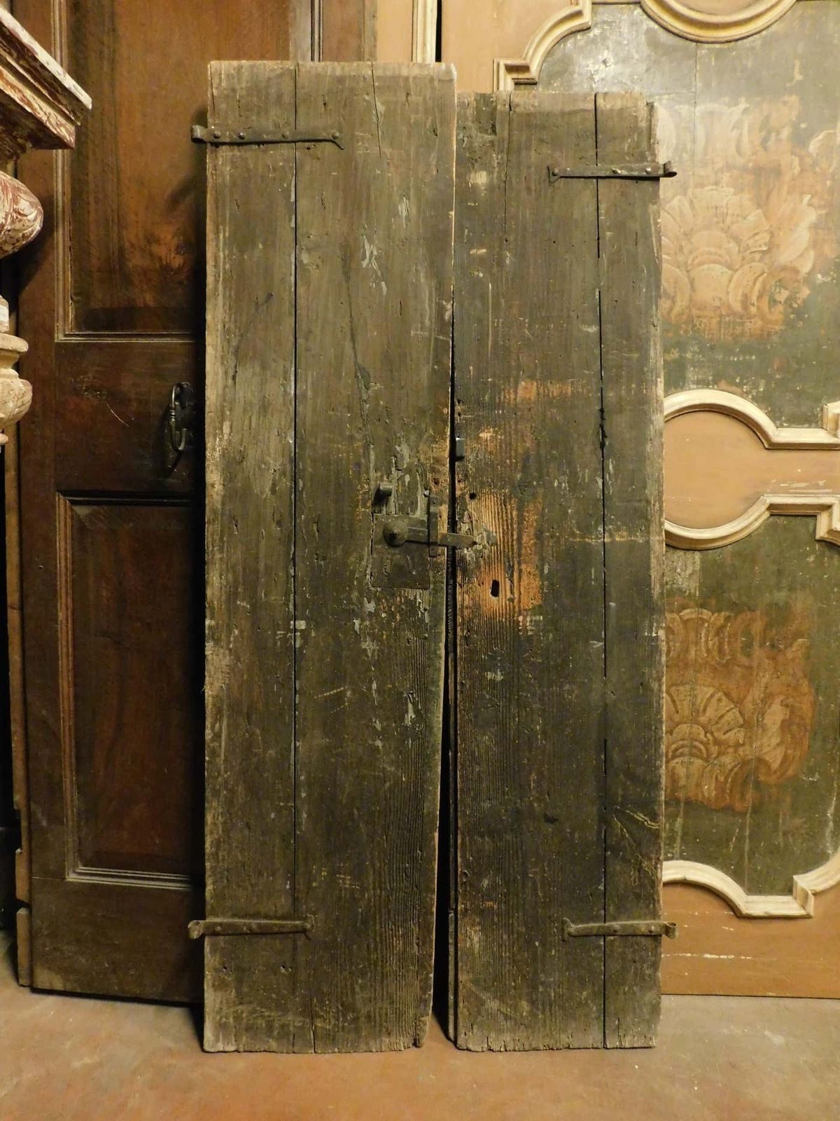 Double Door In Rustic Larch Wood, Black Background And Painted Panels, Italy photo vintage